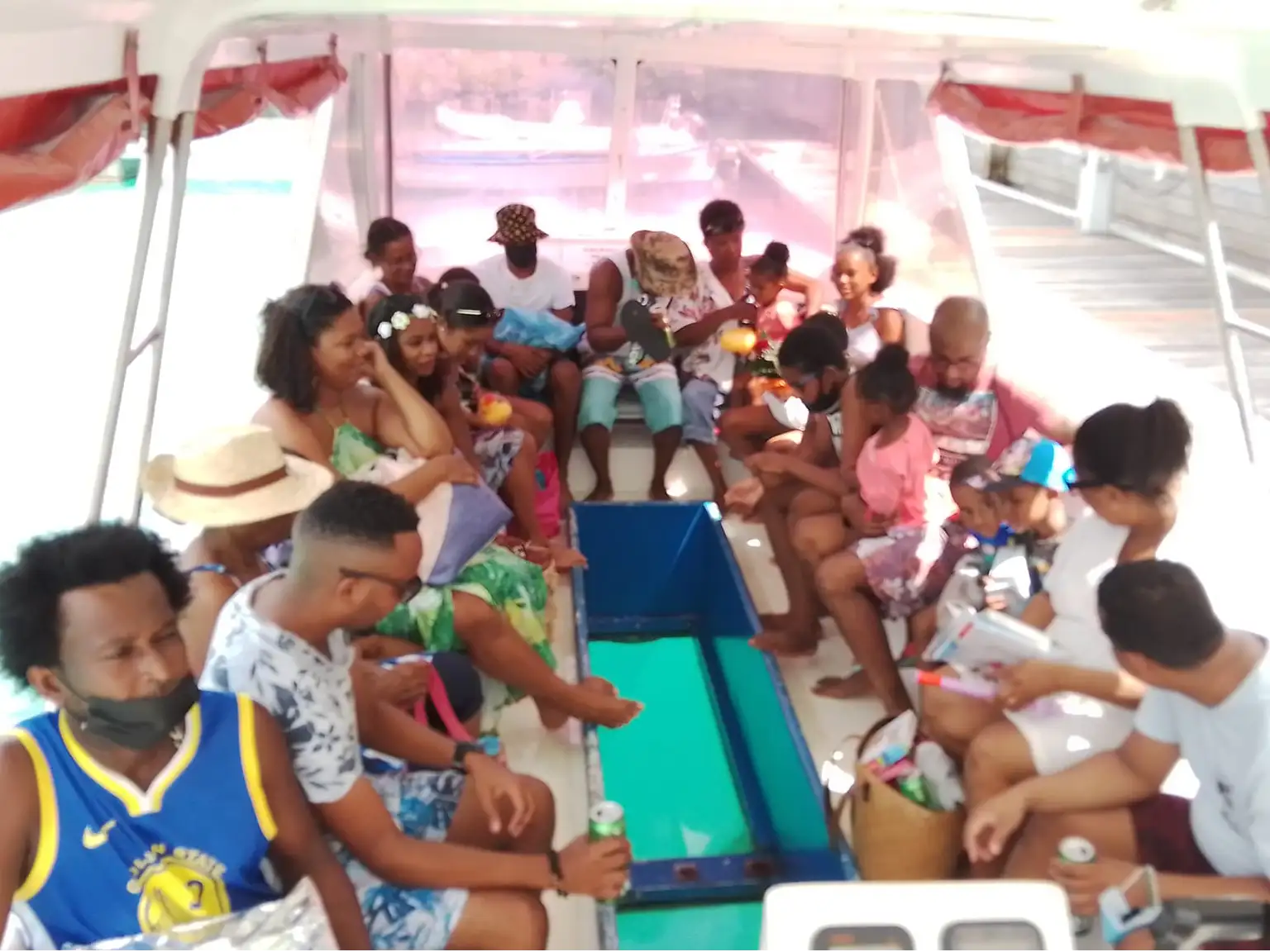 Guests aboard the original Dolphin Nemo glass-bottom boat in the Seychelles